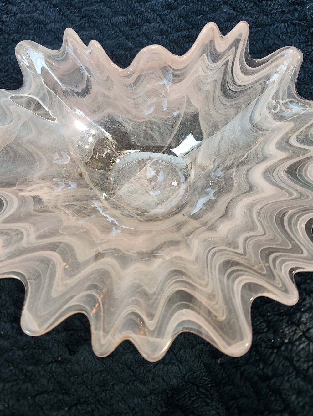 vintage art glass trinket dish featuring a light pink and white swirled pattern
